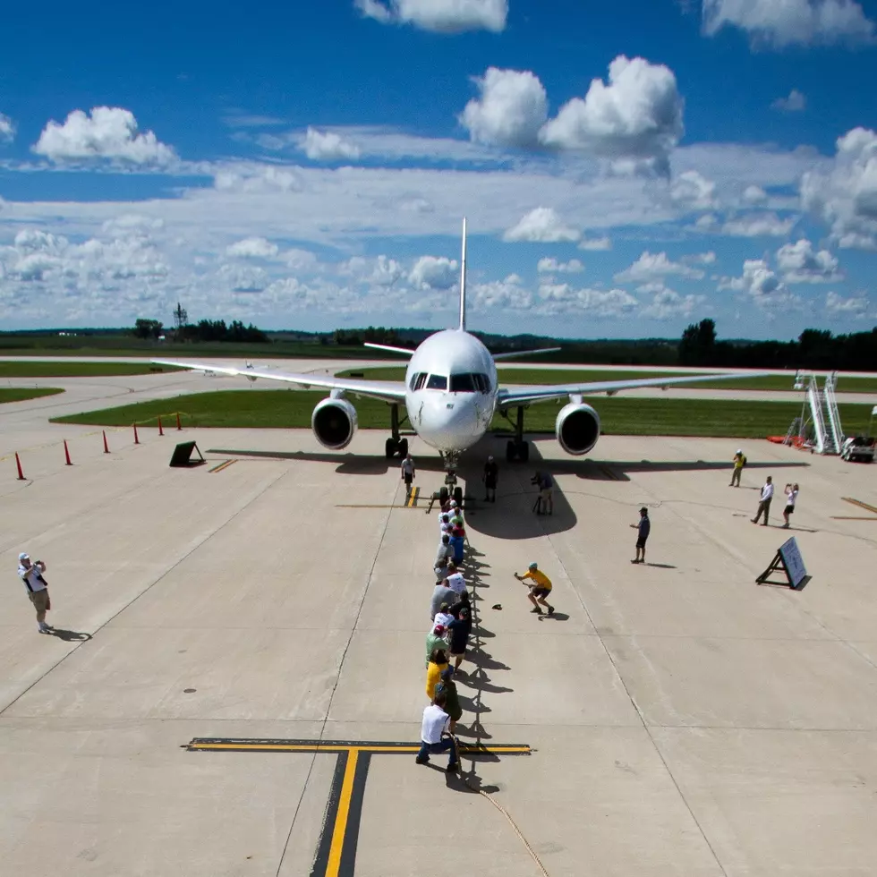 Watch People Pull A 757 Airplane!