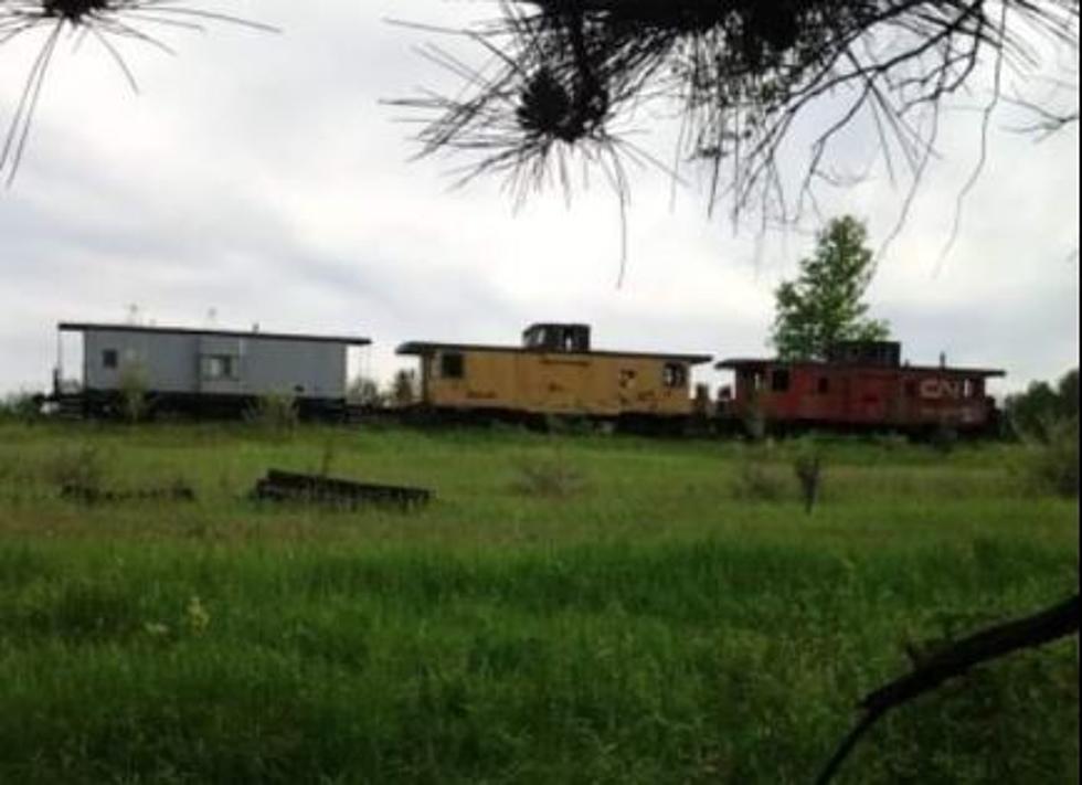 There Are Abandoned Cabooses On The Rails In Clare, Michigan