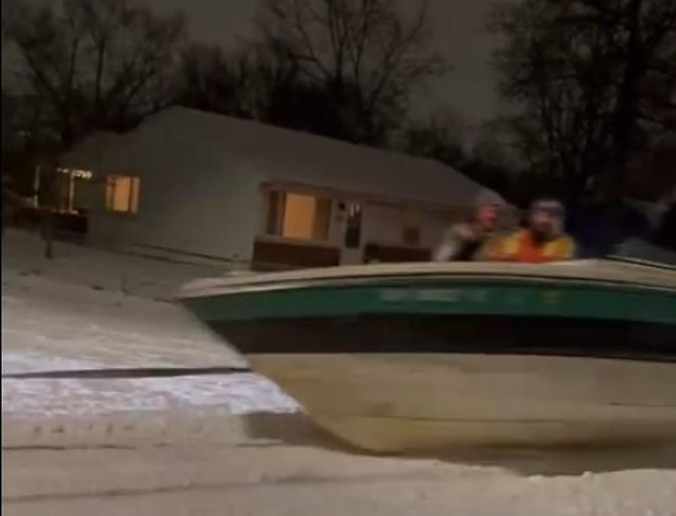 A Skier and Boat Towed Through The Streets In The Snow Has To Be Pure Michigan, but it’s in Ohio.