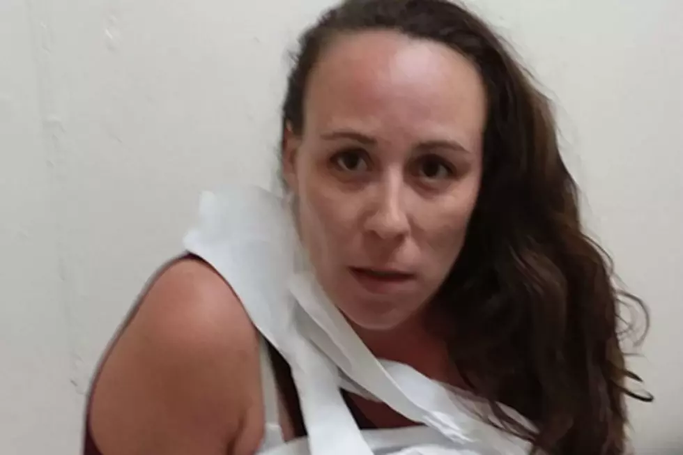 A NH Woman Posed For Her Mugshot Wrapped In Toilet Paper