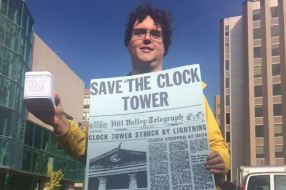 A Guy in Monument Square in Portland Raises Money to ‘Save the Clock Tower’ on ‘Back to the Future Day’ [VIDEO]