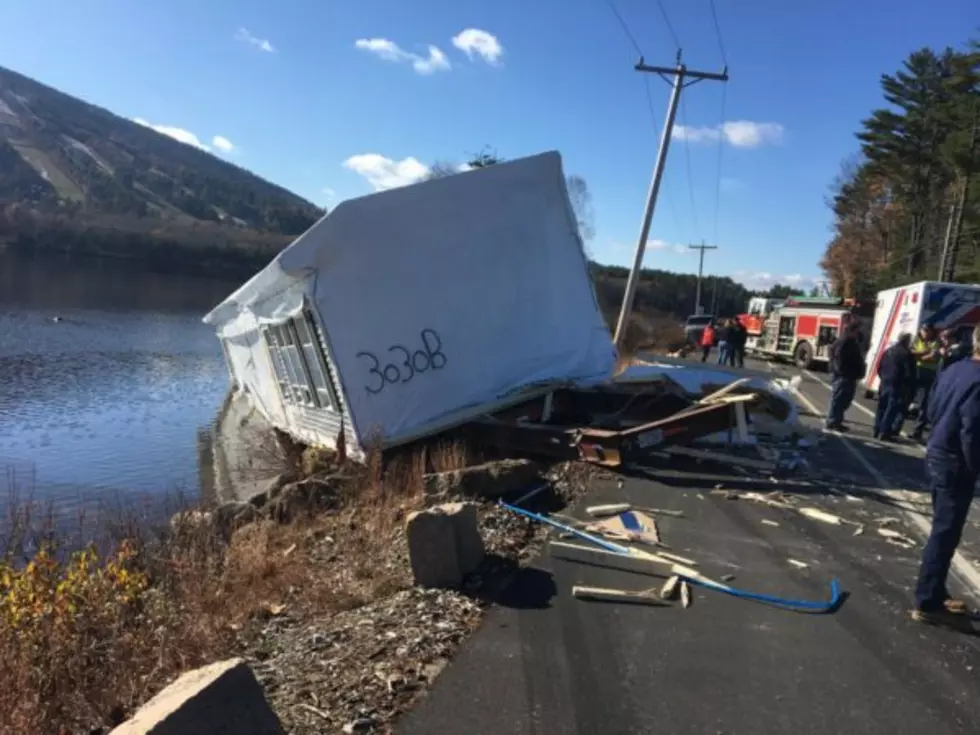 Modular House Falls Off Tractor Trailer & Slides Into Moose Pond in Bridgton