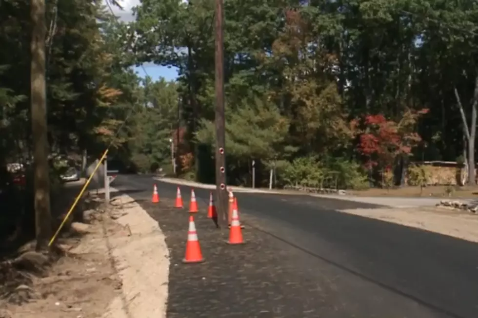 NH Town Paves Around Pole Near Middle of Road 