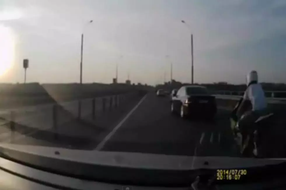 Unbelievable Dash-Cam Video of Motorcycle Crash in Russia