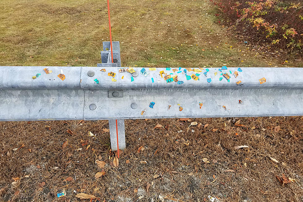 A Guardrail in Windham Is Littered With Registration Stickers