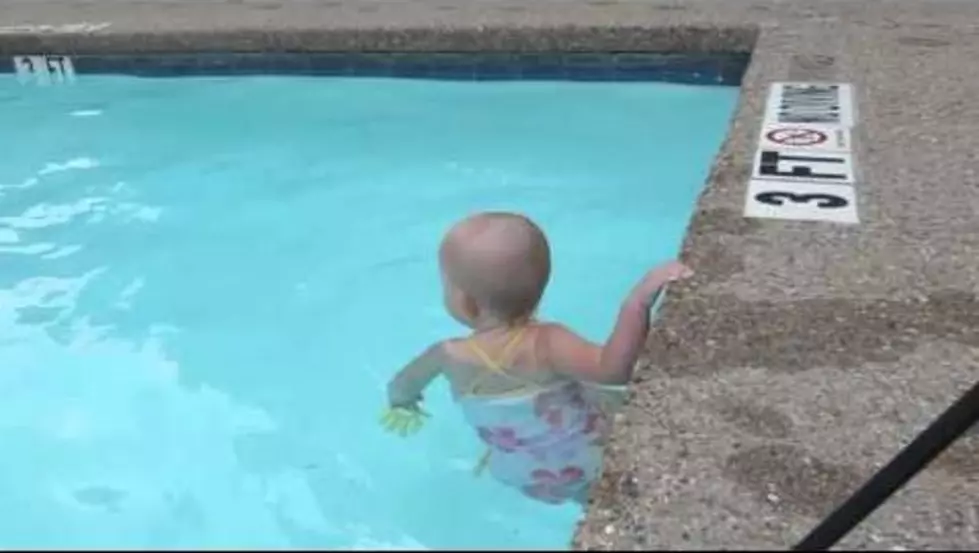 Watch a 16-Month-Old Baby Swim Across a Pool Better Than You and I