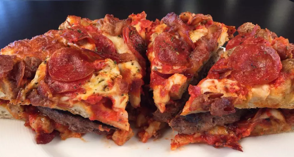 Enjoy Feasting On This Quadruple Cheeseburger Wrapped In Pizza