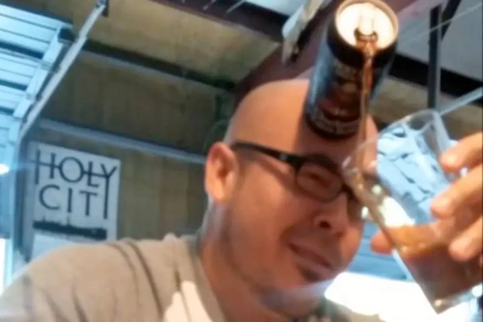 Guy Pours Beer With His Forehead