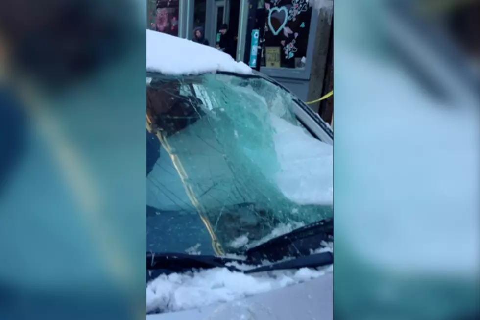 Massive Chunks of Falling Ice Destroys Parked Car