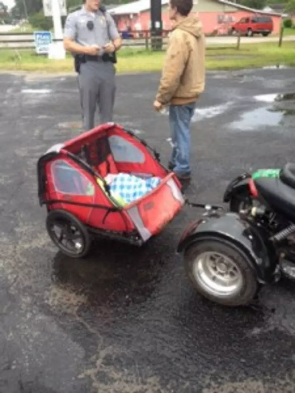 Couple Arrested For Towing Baby Behind Moped