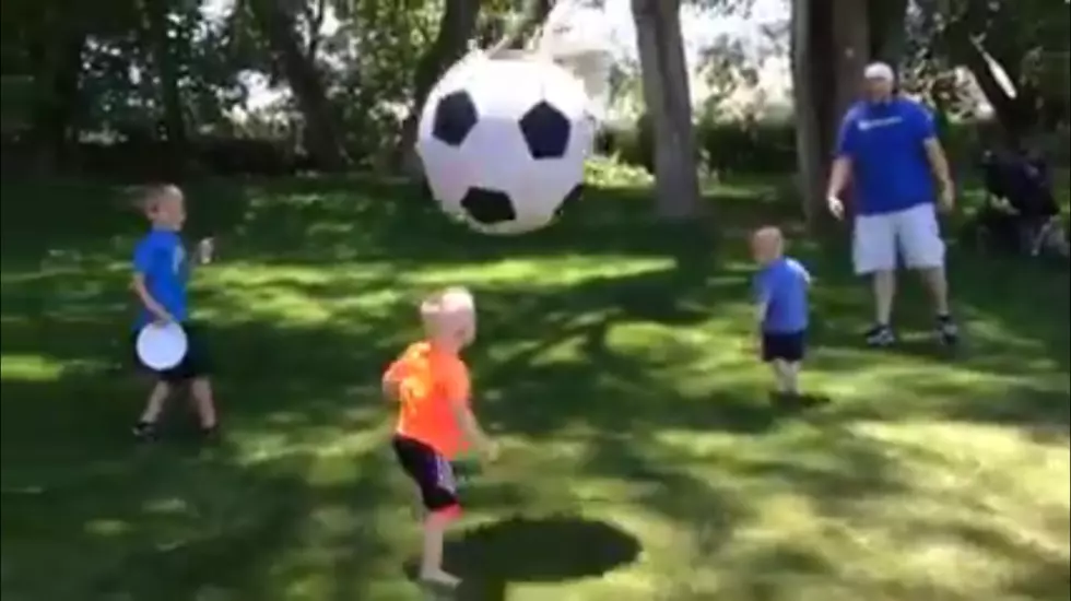 Father Takes Out His Son with a Giant Soccer Ball