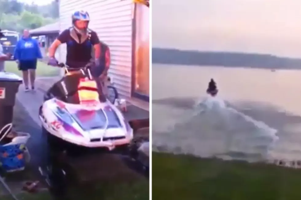 Guy Crosses Open Lake on a Snowmobile