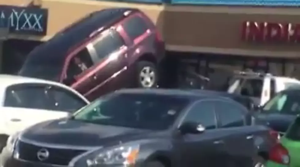 SUV Driver Enters Tug of War with Tow Truck