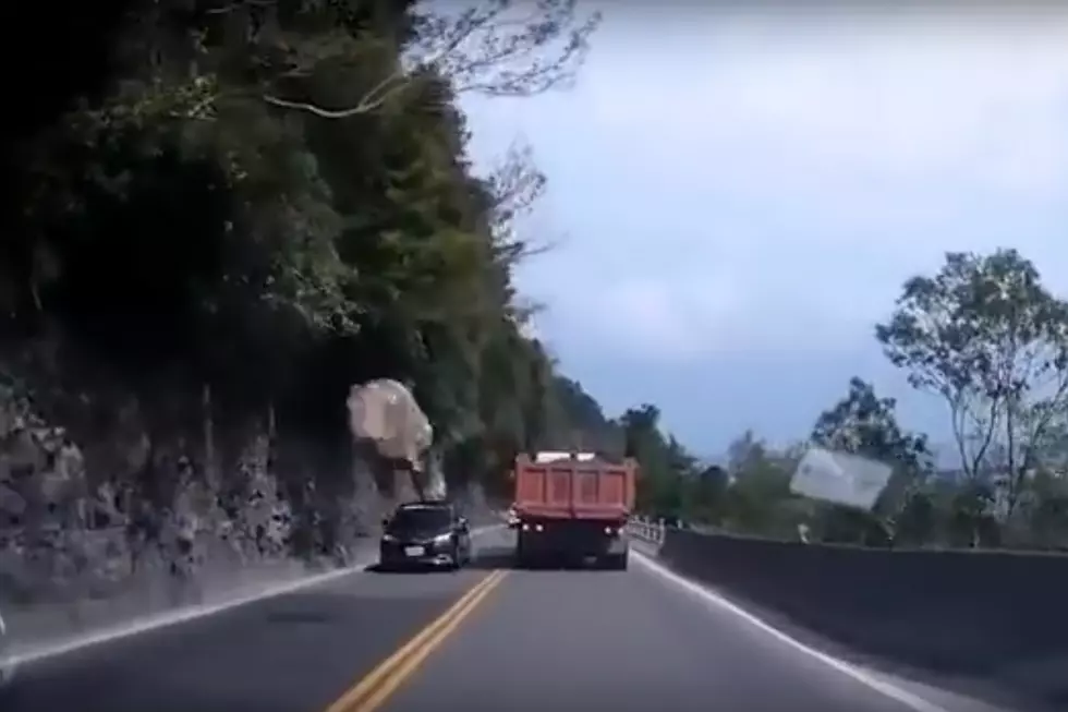Watch a Massive Boulder Narrowly Miss a Car and Crash Onto a Highway