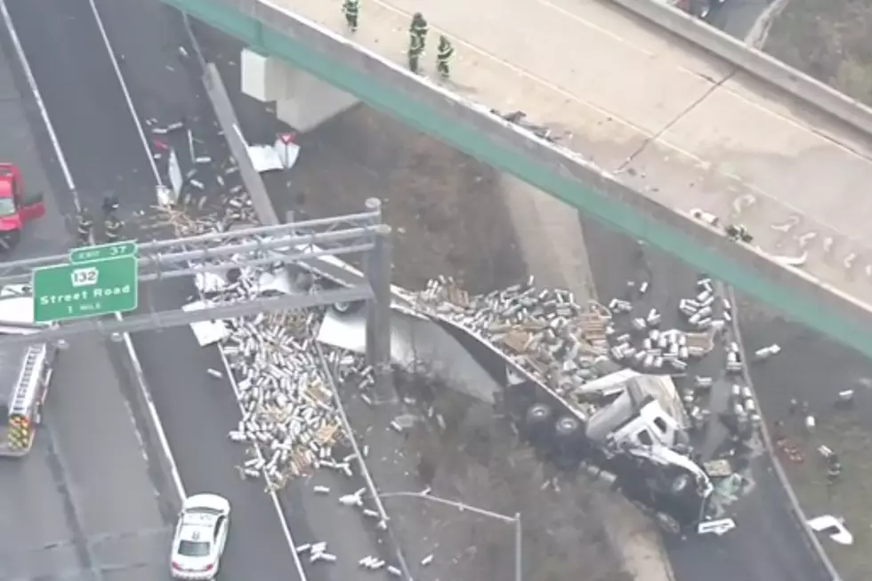 Beer Truck Spills Kegs From Overpass Onto Highway
