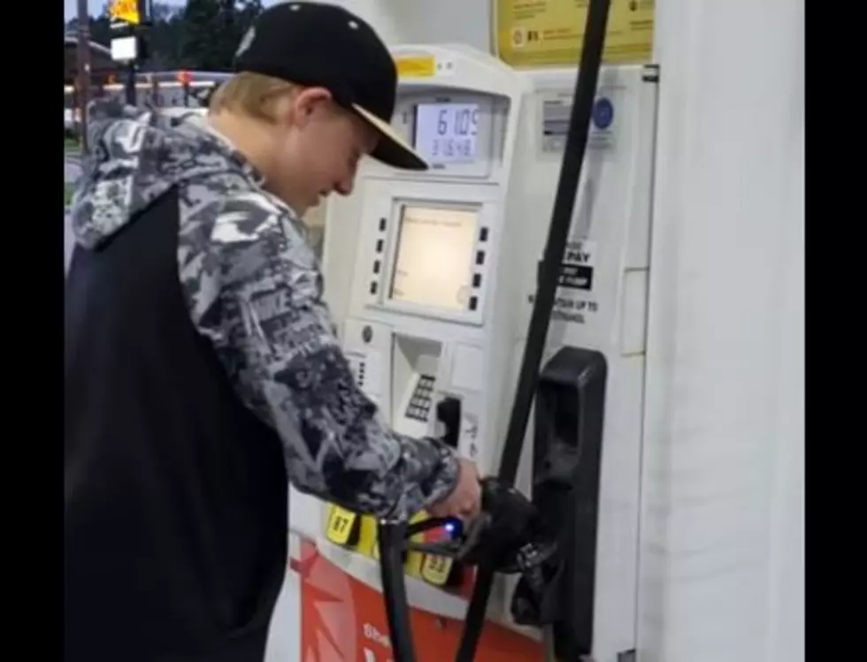 Kid Can&#8217;t Figure Out How To Put Gas Nozzle Away
