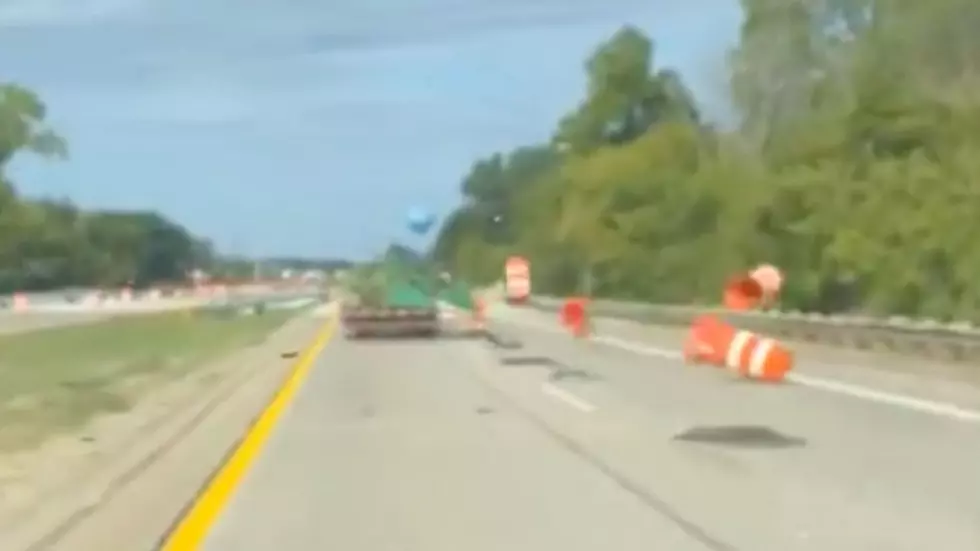 Oversized Load Sends Construction Cones Airborne