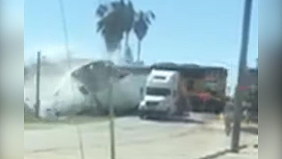 WATCH: Train Crashes Into Trailer Carrying Bottled Water