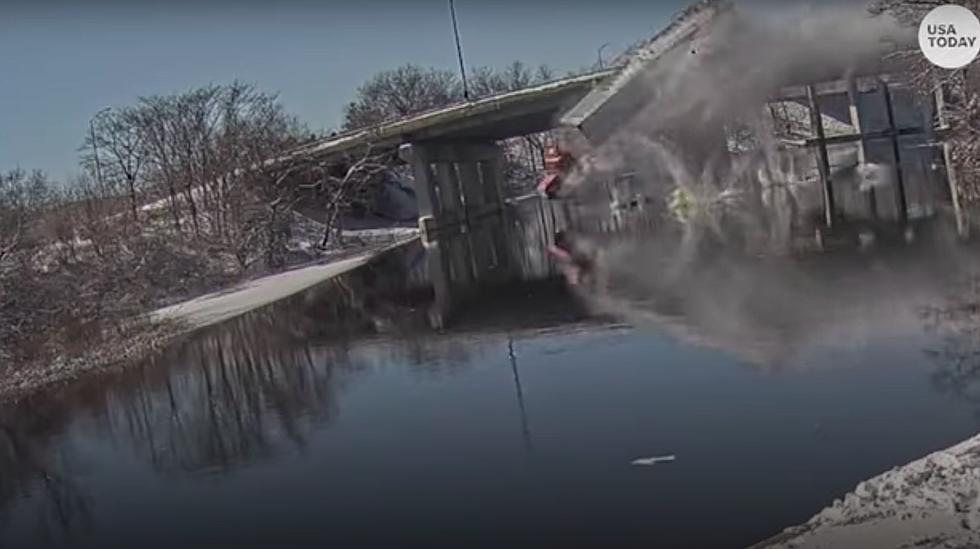 [VIDEO]: Driver Walks Away After Semi Blasts Off Bridge into River