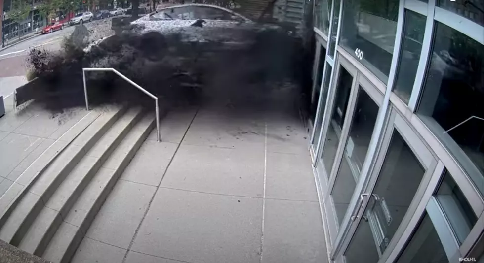 WATCH This Tesla Driver Lose Control and Crash Through A Building