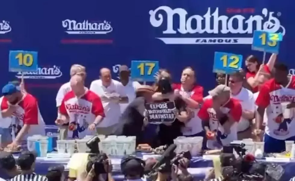 Joey Chestnut Chokes Out Hot Dog Contest Protestor, Continues On To Win