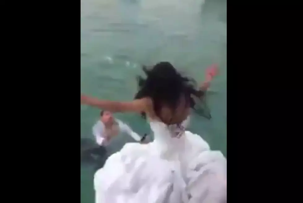 &#8216;Trash The Dress&#8217; Bride Nearly Drowns After Jumping Into Water Wearing Gown [VIDEO]