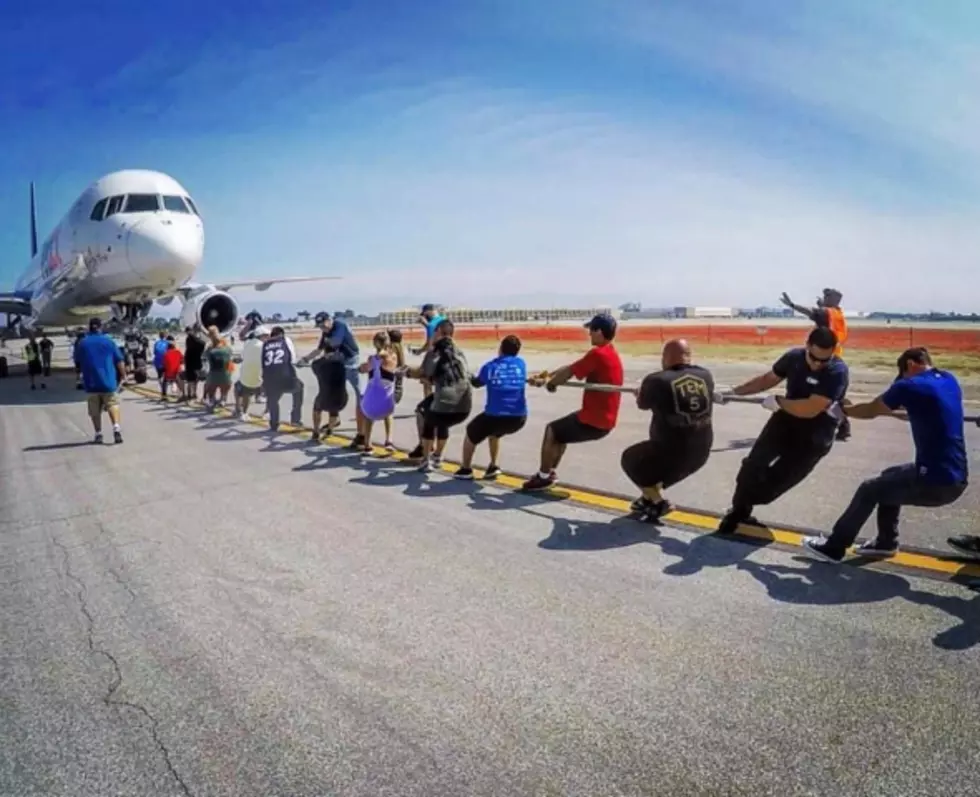 Rockford Gym Playing Tug of War with an Airplane to Raise Money for Special Olympics