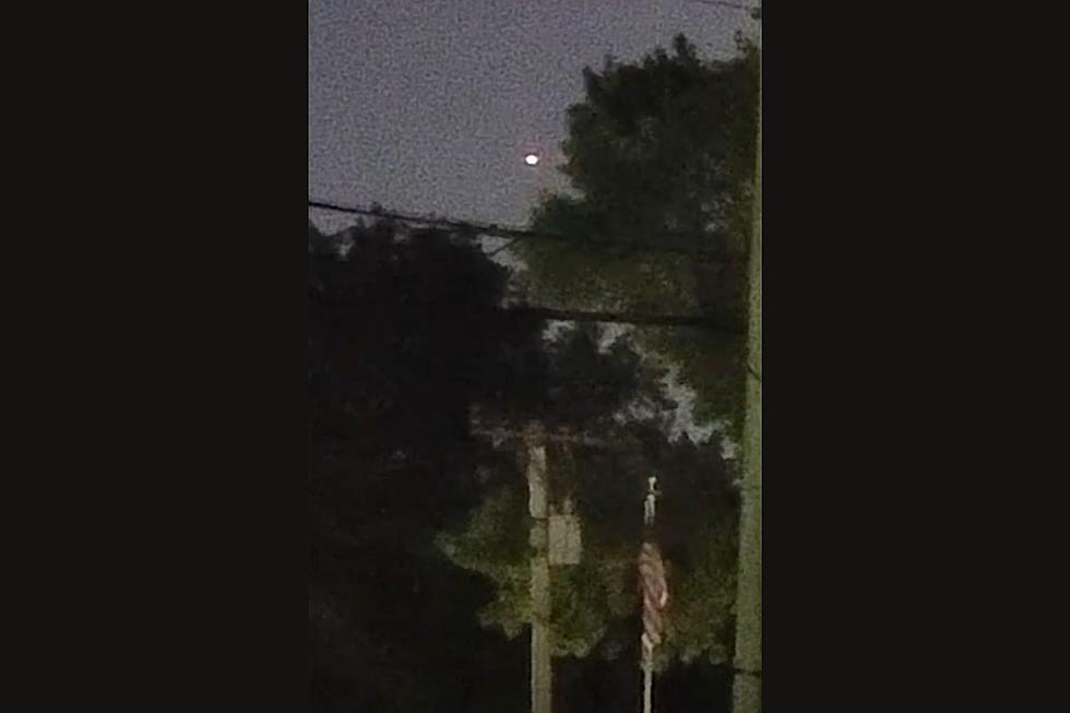 Intense Round Light Filmed Hovering and Flying Over Springfield Illinois
