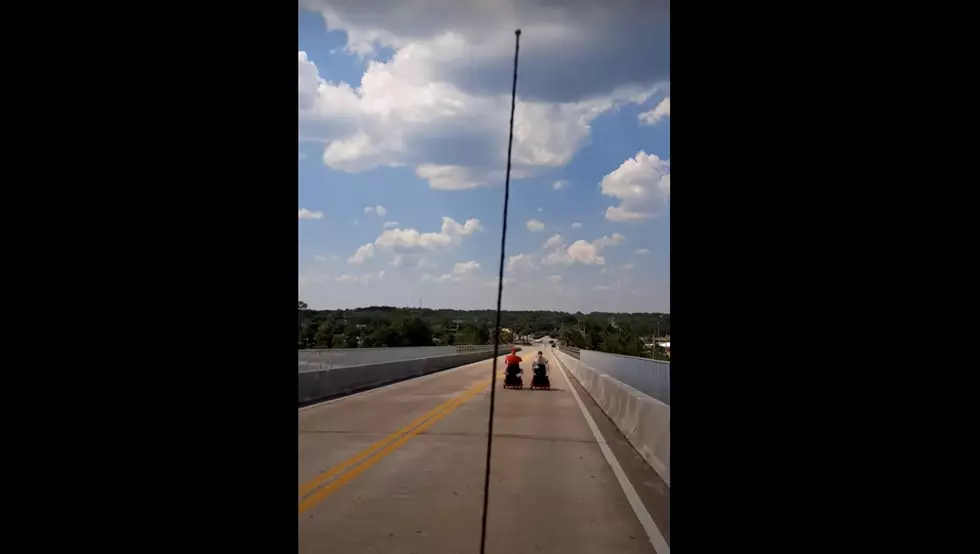 Elderly Couple on Electric Scooters Drive on Highway in Florida (VIDEO)