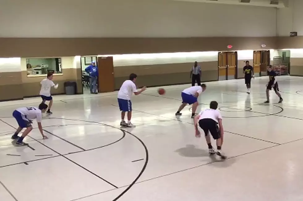 Why Are These Guys Playing Football During a Basketball Game?