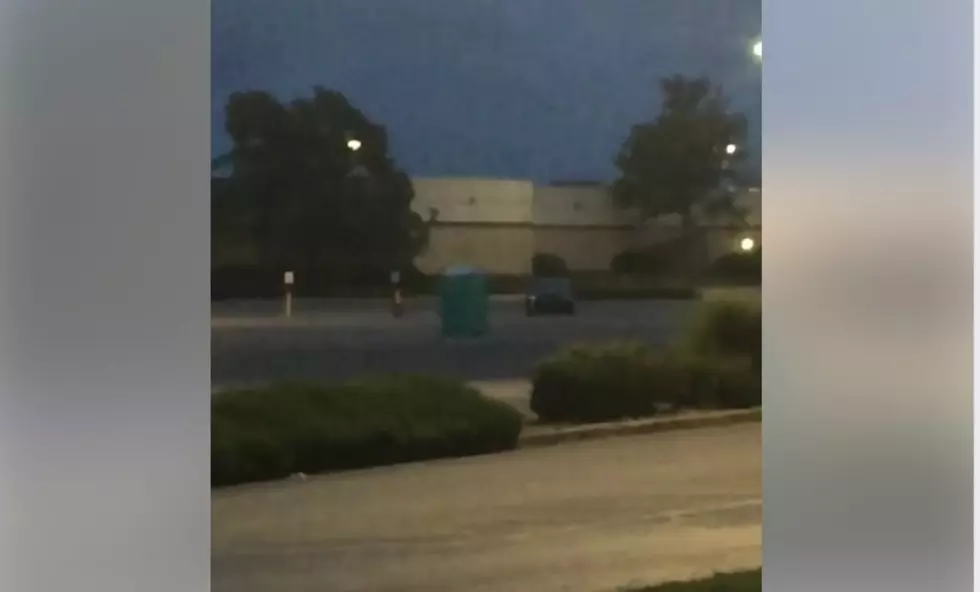 Storm Blows Porta Potty Across Parking Lot [Video]