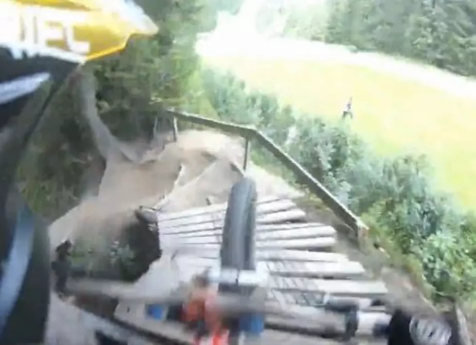 Down Hill Mountain Bike Riders Forget Their RedBull Wings As They Launch Of A Jump