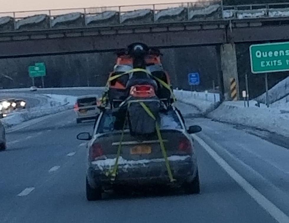 Spotted on the Northway, Snowmobile Strapped to the Roof of a Car