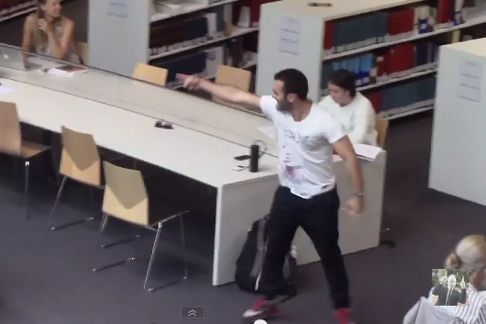 Guy Throws One Man Rave in Sydney Library