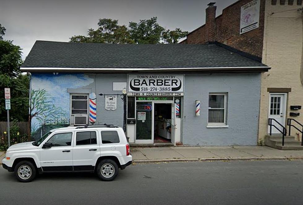 A Cut Above: Longtime Troy Barber Celebrated with Massive Billboard