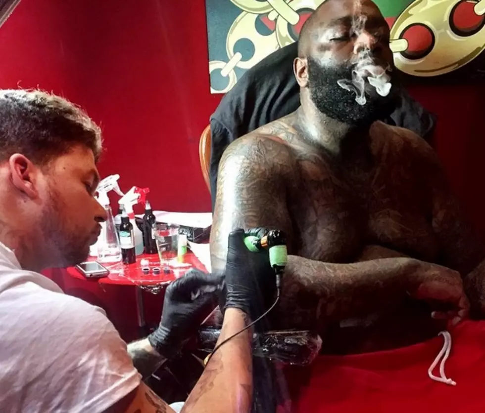 7 Pics of Rappers Getting Tatted