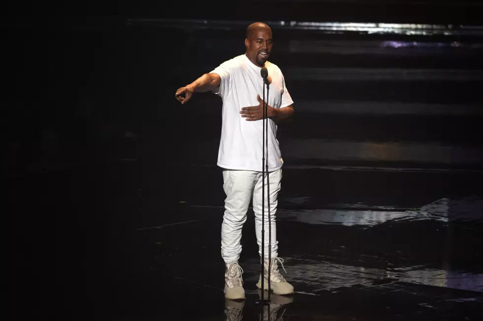 Kanye West Breaks Up Fight Between Paparazzi 