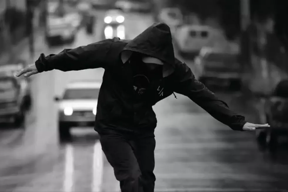 Evidence Wanders in the Rain in 'Throw It All Away' Video