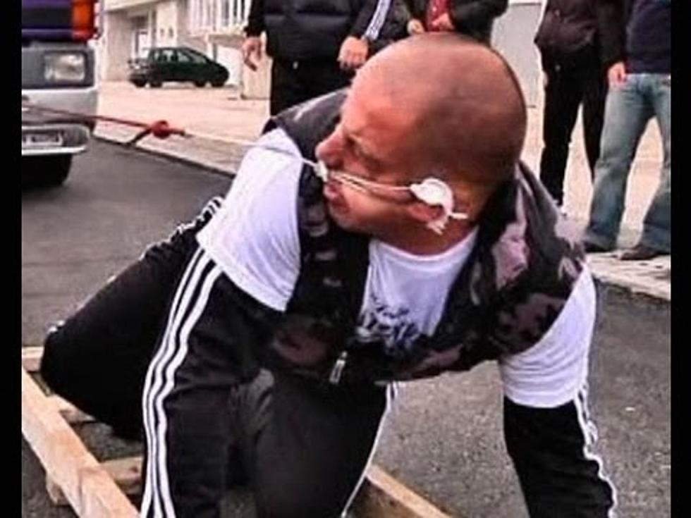 Strongman Pulls Eight Ton Truck With His Ear [VIDEO]