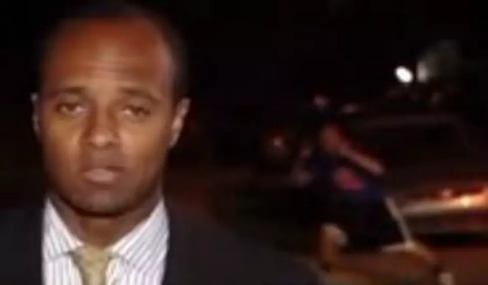 Man Moons Camera During Live News Report [VIDEO]