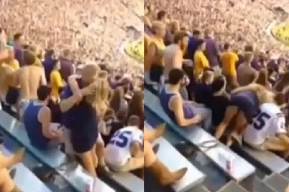 Drunk College Football Fans Fall Down Bleachers While Kissing [VIDEO]