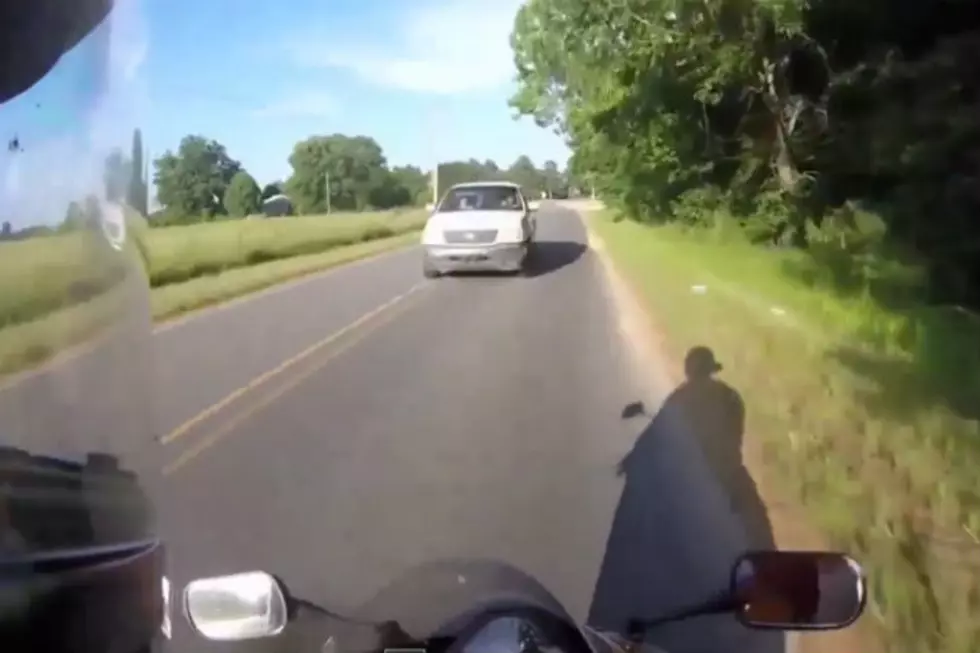 Jerk Runs Biker Off The Road, Gets Business End Of Helmet [VIDEO]