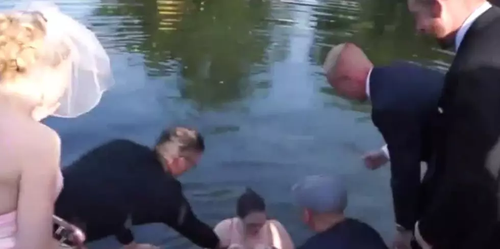 Clumsy Wedding Photographer Falls Into Lake While Shooting [VIDEO]