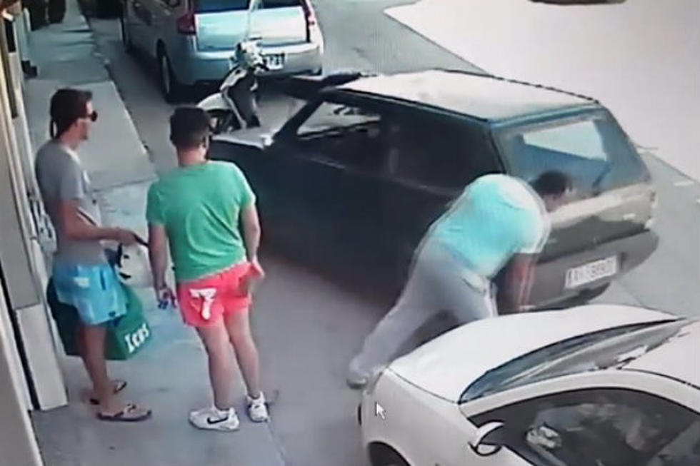 Big Man Picks Up Car And Moves It To Get Out Of Spot [VIDEO]