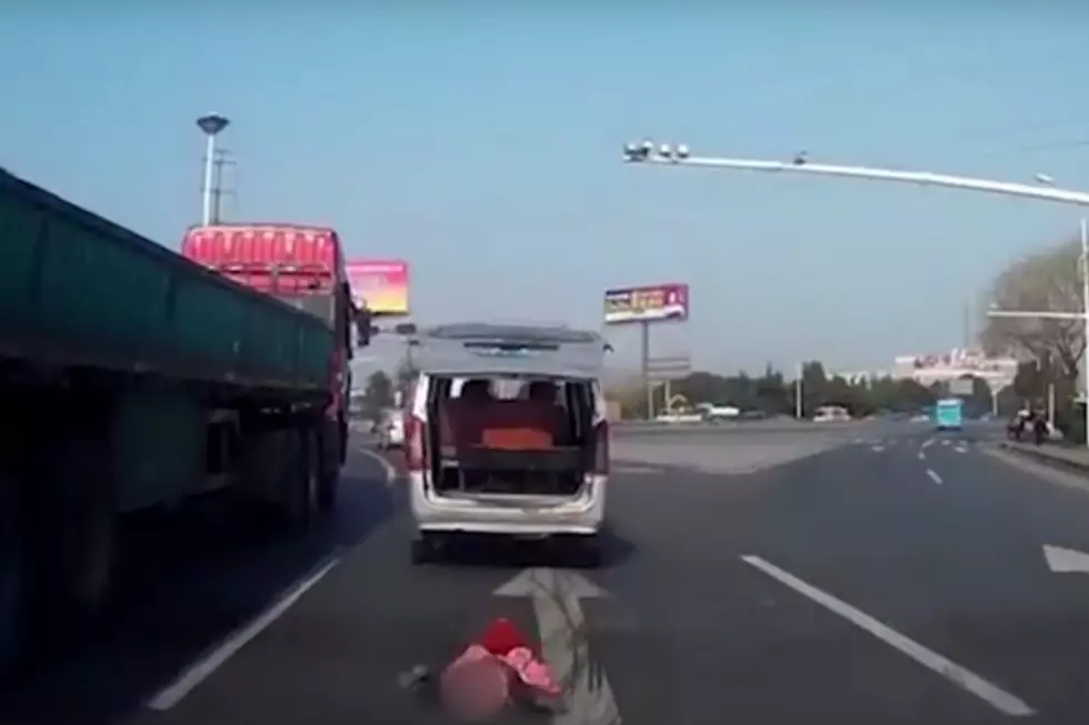 WTF? Kid Falls Out Of Moving Van In China [VIDEO]