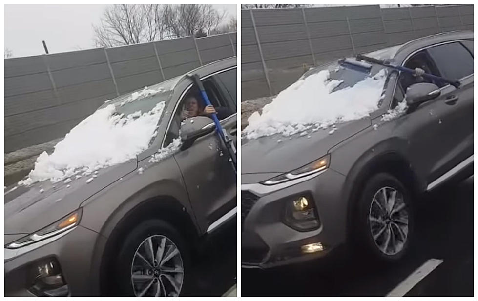 Woman Attempts To Clear Snow From Windshield While Driving [VIDEO]