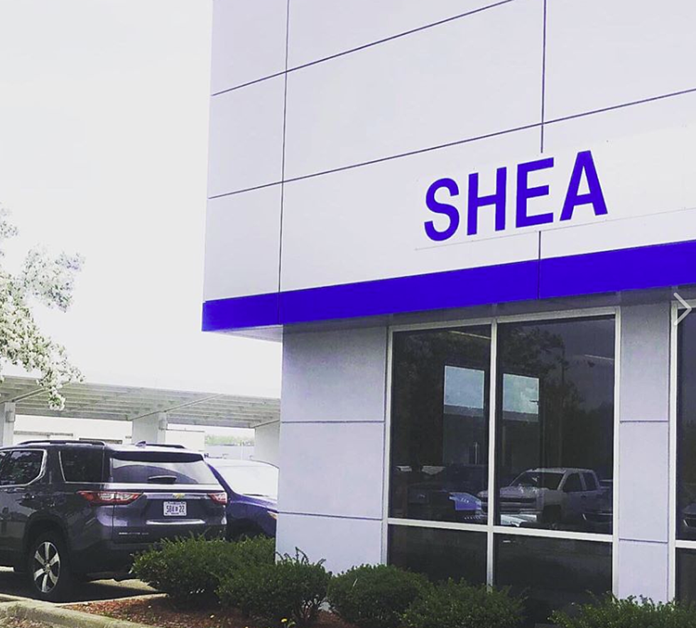 Shea Automotive Passing Out Bags Filled With Food, Coloring Books, And More For Kids