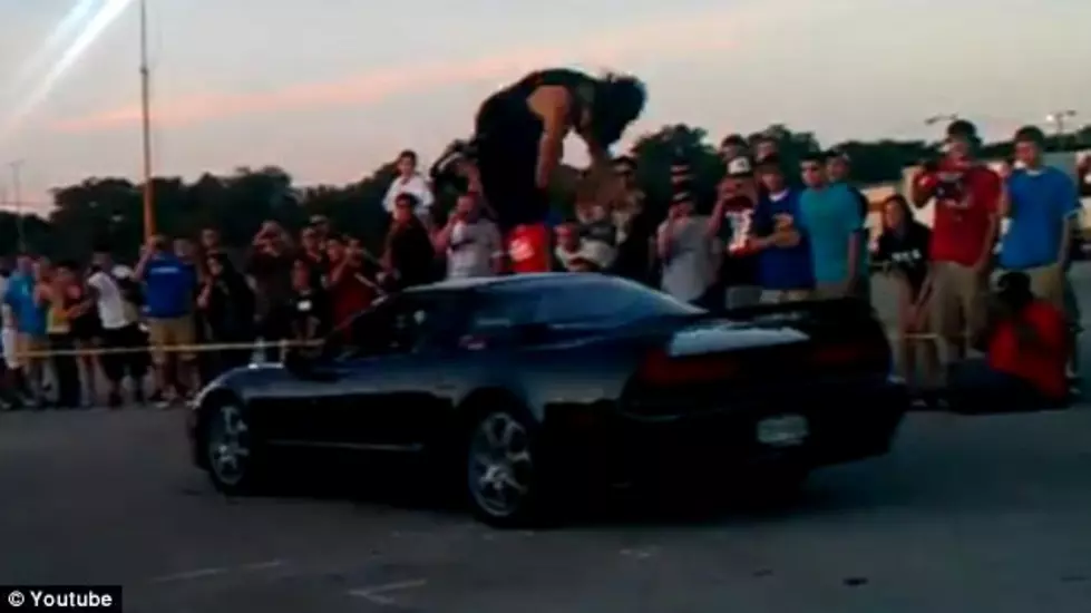 Aaron Evans Flips Over Moving Car [Video]