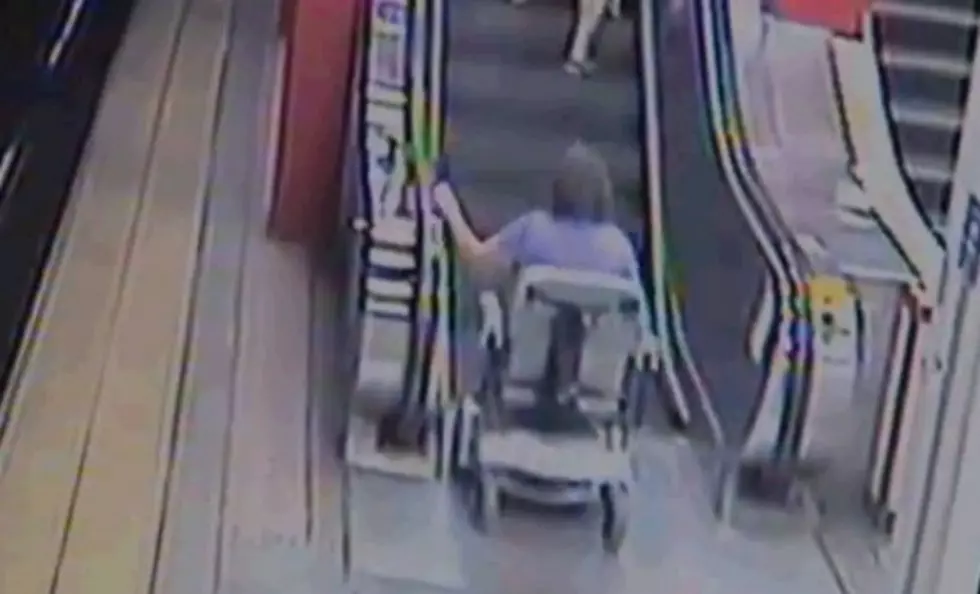Lady In Motorized Wheel Chair Versus The Escalators [Video]
