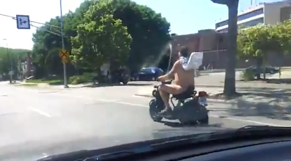 Riding A Scooter Wearing Only Thongs And A Cape Is Perfectly Legal [Video]